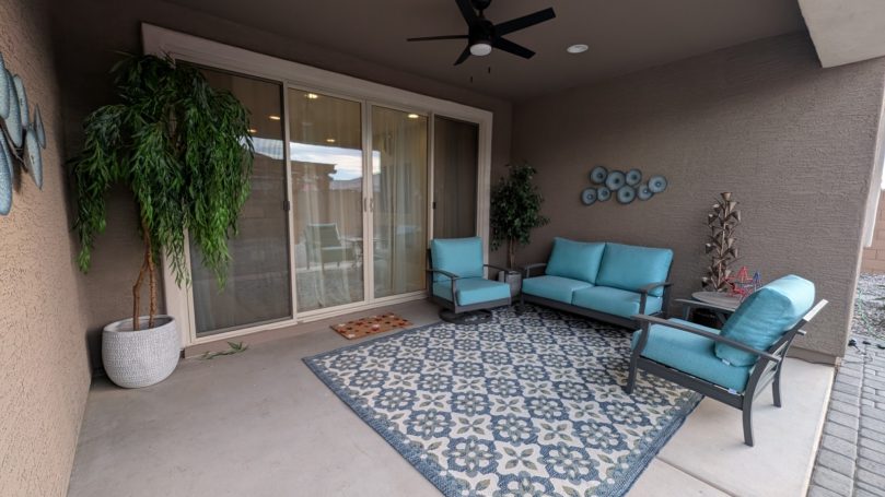 Covered Patio Covered outdoor patio with comfortable seating at Desert Willow Memory Care.