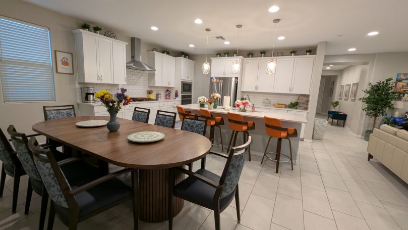 Dining Room & Kitchen Bright open-concept dining room and modern kitchen at Desert Willow Memory Care with comfortable seating and spacious layout.